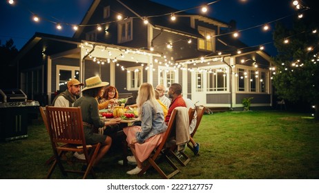 Big Family Garden Night Party Celebration, Gathered Together at a Table with Relatives and Friends. Young and Senior People Eating, Drinking, Sharing Dishes, Chatting and Having Fun. - Shutterstock ID 2227127757