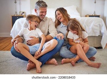 Big Family, Happy And Smile With Quality Time At Home In A Bedroom With Children. Happiness Of Mother, Man And Kids Laughing At A Funny Joke On The House Floor Together With Joy And Parent Love