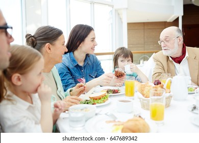 Big Family Having Breakfast Or Dinner