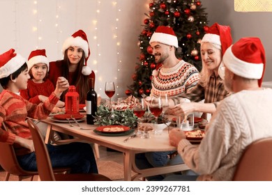 Big family having Christmas dinner at home in evening - Powered by Shutterstock