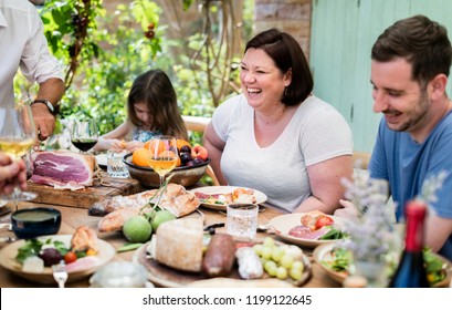 Big Family Having Dinner At The Veranda