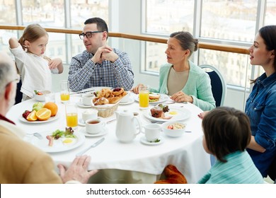 Big Family Having Talk By Breakfast In Restaurant