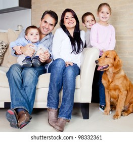 Big Family At Home With A Dog, All Looking Very Happy