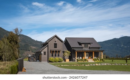 Big family house built on farm land. Residential house with big green lawn in front on sunny day in British Columbia. Typical North American Country Farm House - Powered by Shutterstock