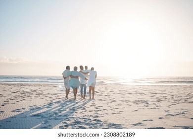 Big family, hug and walking on beach with mockup space for holiday, weekend or vacation. Grandparents, parents and kids on a ocean walk together by the coast for fun bonding or quality time in nature - Powered by Shutterstock