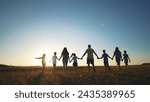 big family. huge community family holding hands walking in the park sunset. happy family kid dream concept. big family community walking with children in sunlight the park. friendly people walking