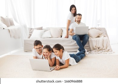 Big family at laptops. Parents and children with gadgets. - Shutterstock ID 1660966888
