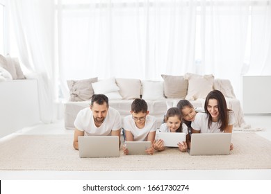 Big family at laptops. Parents and children with gadgets. - Shutterstock ID 1661730274