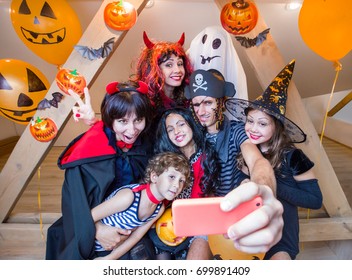 Big Family Making Selfie On Smartphone In Halloween Costumes