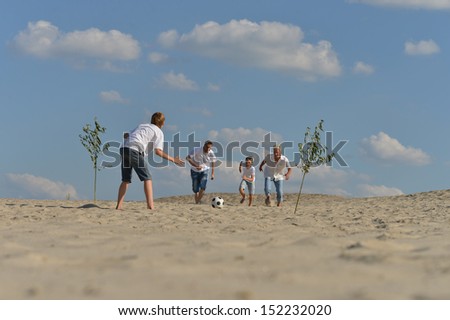 Similar – Image, Stock Photo Three generations female playing soccer on the beach