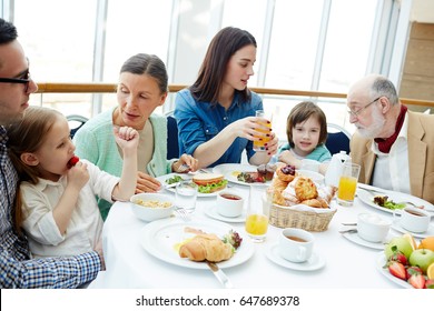 Big Family Of Three Generations Having Breakfast In Restaurant