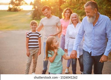 Big family walking in park