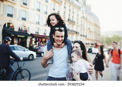 Big Family Walking The Streets In Paris