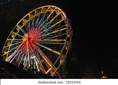 Big Ferris Wheel, East Princes Street Gardens, Edinburgh, Scotland, part of the Christmas and Hogmanay holiday attractions, at night.
