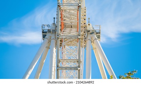 A Big Ferris Wheel Over Blue Sky In The Summer. Front View