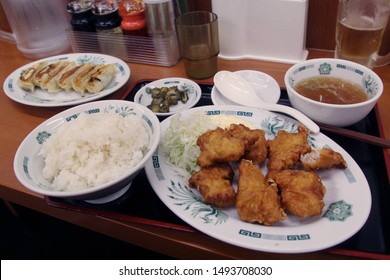 Big Food Set In A Japanese Restaurant In Tokyo: Karaage Fried Chicken And Gyoza Dumplings