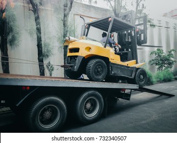 Big Forklift Truck Move Reverse To The Big Truck For Transport And Move To Outdoor Or Other Working Area