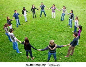 big friends doing a circle smiling and having fun in the park