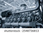 Big gas engine diesel generator electric power with many wires pipes industrial machine concept background