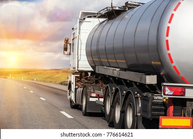 Big gas-tank goes on highway against the sky