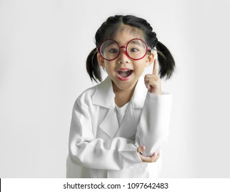 Big Glass Science Asian Girl Kid Model Thinking Idea Action On White Background. Kid Portrait In Doctor Or Science Costume.