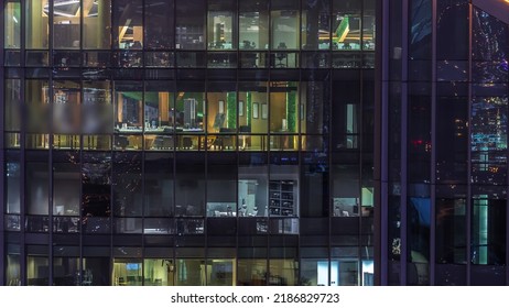 Big Glowing Windows In Modern Office Buildings Timelapse At Night, In Rows Of Windows Light Shines. Towers In Financial Center