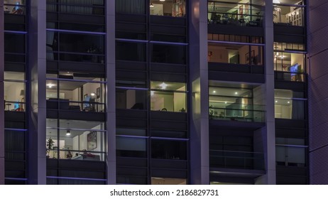 Big Glowing Windows In Modern Office And Residential Buildings Timelapse At Night, In Rows Of Windows Light Shines. Work Place At Home