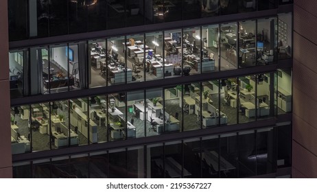 Big Glowing Windows In Modern Office Buildings Timelapse At Night, In Rows Of Windows Light Shines. Open Space Working Places