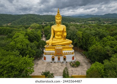 Big Gold Buddha statue at Wat Pha Thang, Uthai Thani, Thailand - Powered by Shutterstock