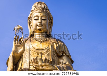 Big Golden brass Guanyin in Chinese Temple, brass statue of goddess mercy in joss house