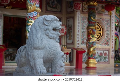 Big Gray Stone Lion,the Guardian Of Sacred Place In East Asian Culture,especially In China.This One Is In Front Of  Grand Pa-Grand Ma Shrine,the Famous Tourist Attraction In Udon Thani,Thailand.