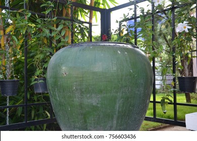 The Big Green Water Jar On The Marbles