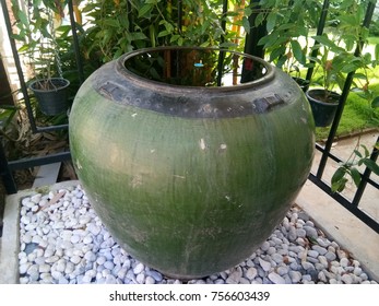 The Big Green Water Jar On The Marbles