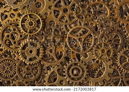 Big group of bronze cogwheels, abstract retro-style industrial steampunk background
