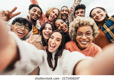 Big group of friends taking selfie picture smiling at camera - Laughing young people celebrating standing outside and having fun - Portrait photography of teens guys and girls enjoying vacation
