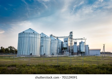 Big group of grain dryers complex for drying wheat. Modern grain silo. Agriculture concept. 