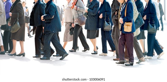 The Big Group Of Older Persons.  People Walking Against A Light Background.