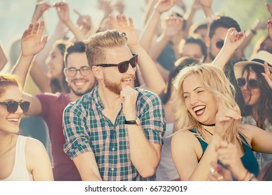 Big Group Of People Dancing And Having A Good Time At Music Festival