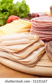 Big Group Of Sliced Meat, Cheese And Vegetables