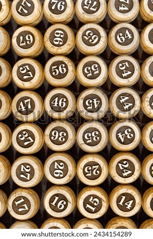 Big group of wooden lotto barrels with numbers, abstract random numbers background
