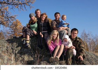 Big Happy Family In Autumn Park