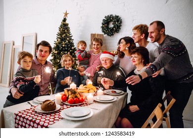 Big Happy Family Celebrate Christmas By Sitting At The Banquet Table And Prepare The Christmas Duck