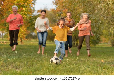 Big Happy Family Playing Football In Autumn Park