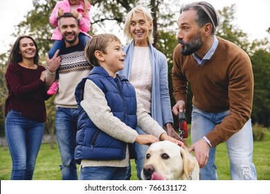 Big happy family with their dog in the park on a sunny day స్టాక్ ఫోటో