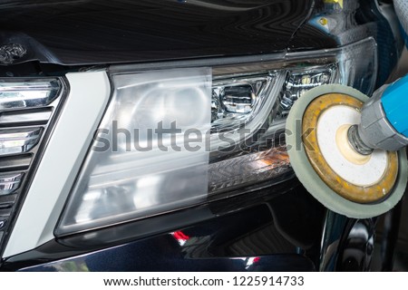 Big headlight cleaning on the car with power buffer machine at service station ,Before and after cleaning