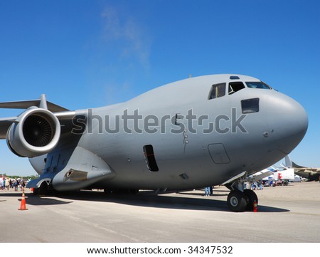 Big and heavy military transport airplane on the ground