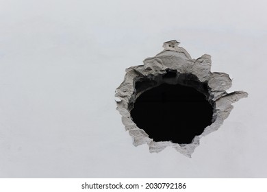 Big Hole On The White Wall
