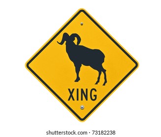 Big Horn Sheep crossing caution sign isolated on white.
