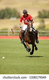 Big Horn, Wyoming - August 7th 2010: Owen Rinehart carries the ball downfield at Flying H Polo Club.