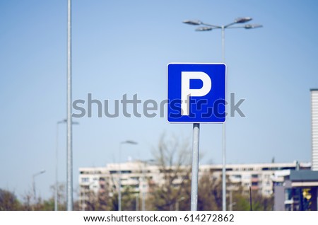 Big Hypermarket Parking Sign With Blue Sky And Parking Lights Behind